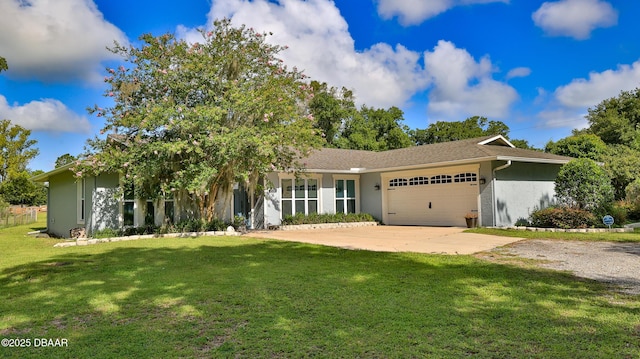 view of front of home with a garage and a front yard