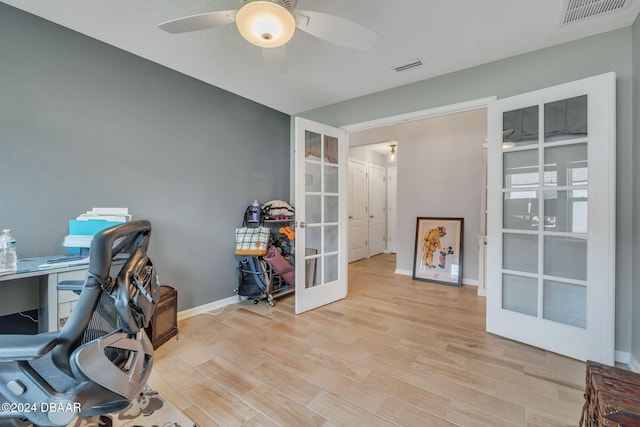 office space with french doors, light hardwood / wood-style flooring, and ceiling fan