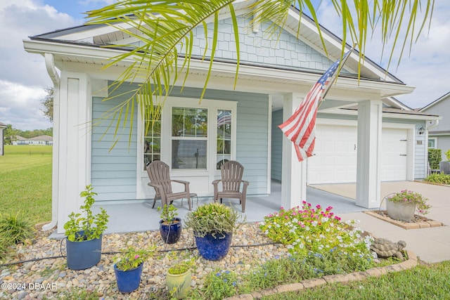 exterior space with a garage and a porch