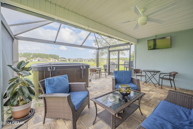 sunroom / solarium featuring ceiling fan