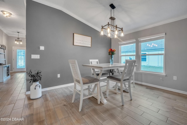 dining room with light wood-type flooring, a notable chandelier, and crown molding