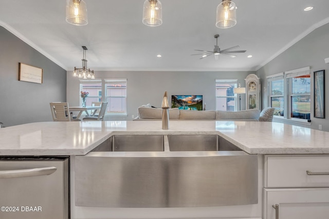 kitchen with white cabinets, a wealth of natural light, and hanging light fixtures