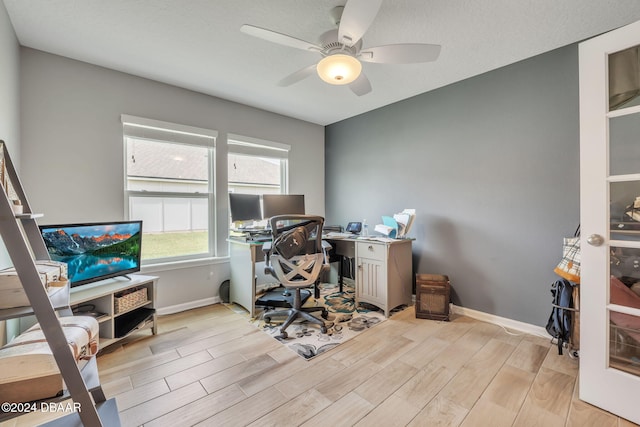 office space with light hardwood / wood-style flooring and ceiling fan