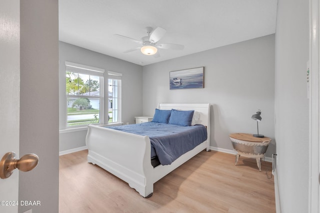 bedroom with hardwood / wood-style flooring and ceiling fan