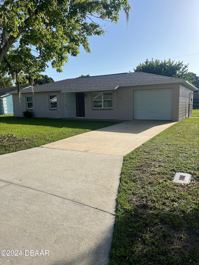 ranch-style home with a garage and a front yard