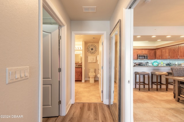 hall with light wood-type flooring