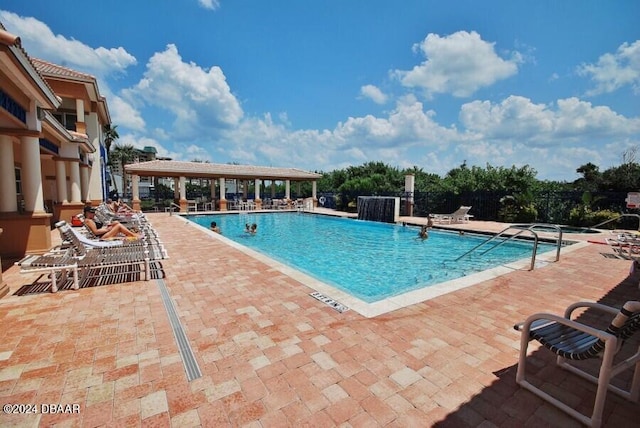 view of swimming pool with a patio