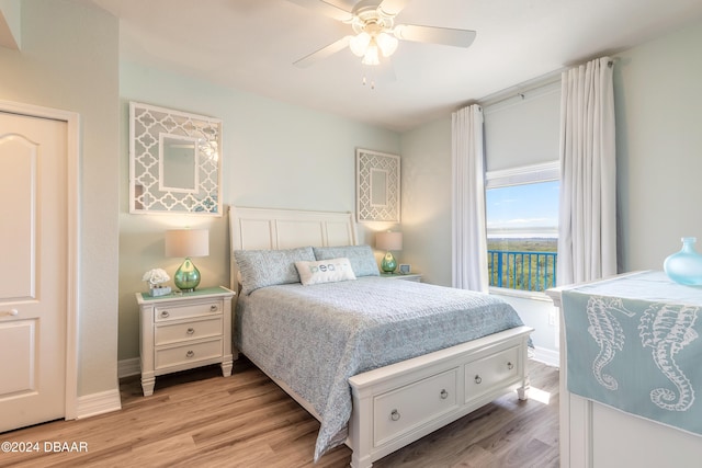 bedroom featuring ceiling fan and light wood-type flooring