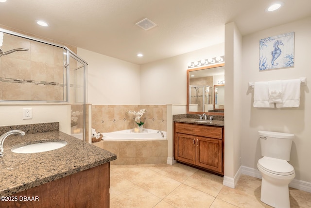 bathroom featuring a sink, visible vents, a garden tub, and a stall shower