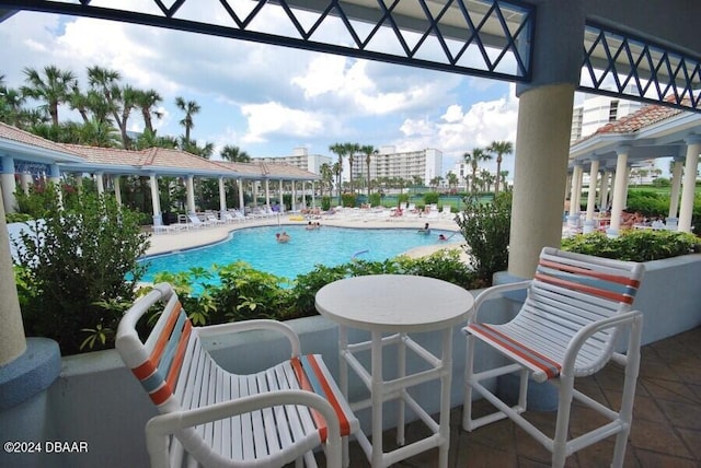 pool with a patio area