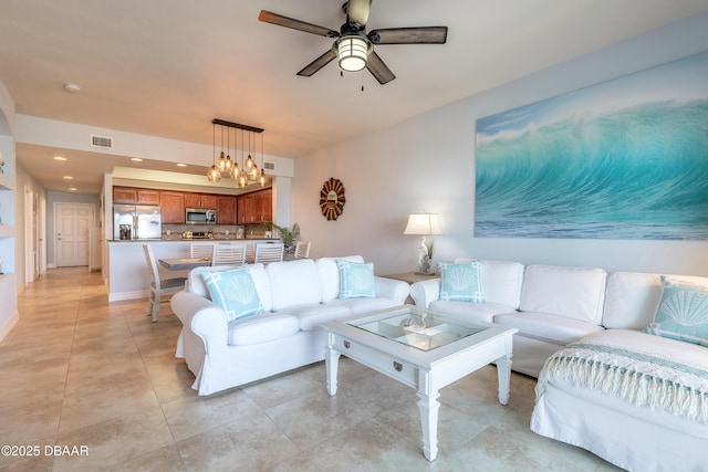 living room featuring light tile patterned floors, baseboards, visible vents, recessed lighting, and ceiling fan