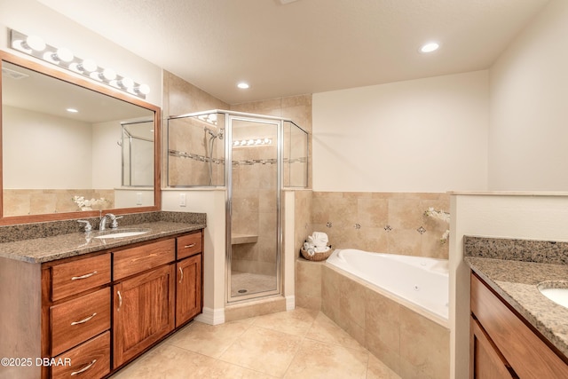 full bath featuring tile patterned floors, vanity, a bath, and a shower stall