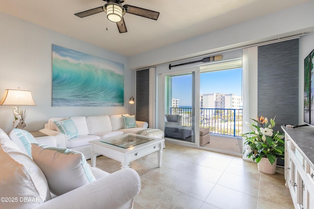 living room featuring light tile patterned flooring and ceiling fan