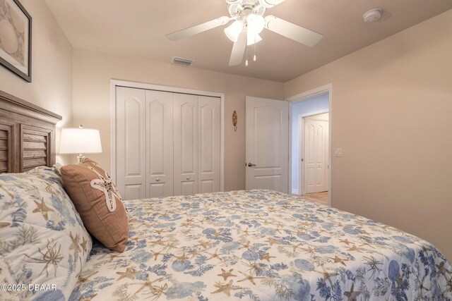 bedroom featuring ensuite bath, ceiling fan, and light hardwood / wood-style flooring