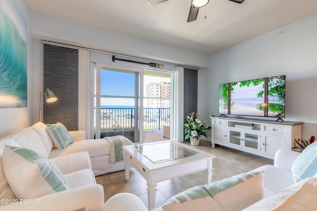 living room with light tile patterned floors and a ceiling fan