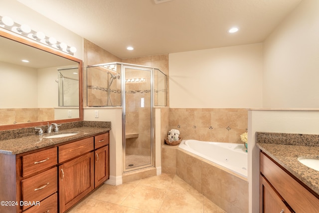 bathroom with vanity, tile patterned floors, and shower with separate bathtub