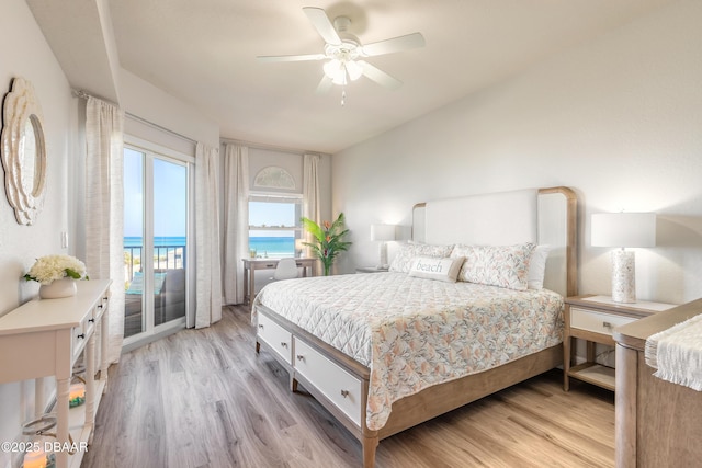 bedroom featuring access to exterior, a ceiling fan, and light wood finished floors