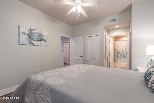 bedroom with a ceiling fan, wood finished floors, visible vents, a closet, and connected bathroom