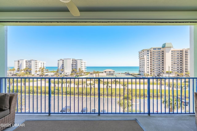 balcony featuring a water view and a view of city