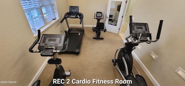 exercise room with baseboards