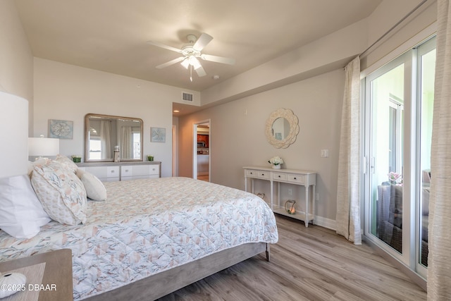 bedroom with visible vents, access to outside, wood finished floors, baseboards, and ceiling fan