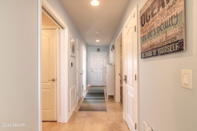 hallway with light tile patterned flooring