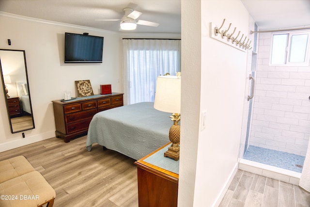 bedroom with multiple windows, ceiling fan, and light hardwood / wood-style flooring