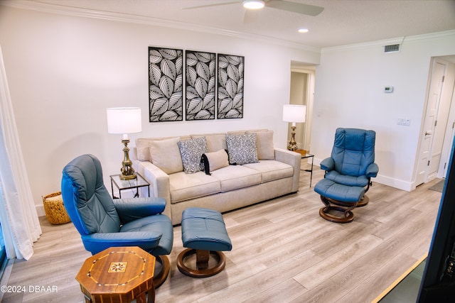 living room featuring ceiling fan, light hardwood / wood-style flooring, and ornamental molding