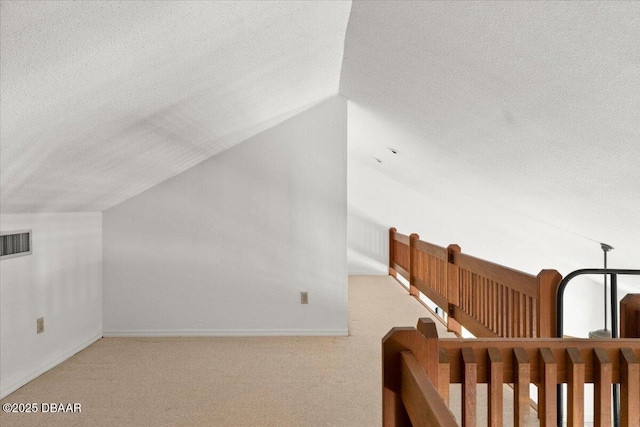 232 Chippewa Cir, Ormond Beach, FL 32174 - bonus room with a textured ceiling, vaulted ceiling, and carpet flooring