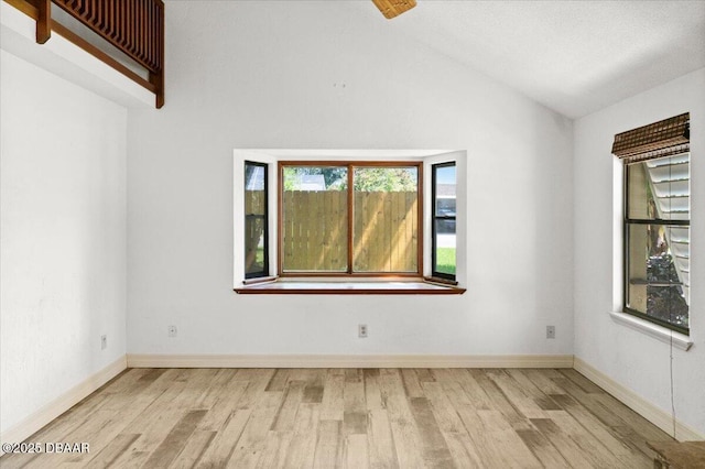 232 Chippewa Cir, Ormond Beach, FL 32174 - empty room with wood finished floors and vaulted ceiling