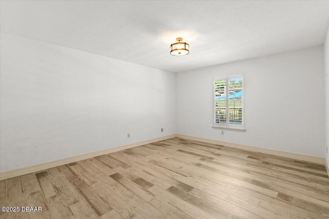 232 Chippewa Cir, Ormond Beach, FL 32174 - unfurnished room featuring light wood-style flooring and a textured ceiling