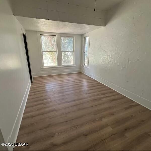 empty room featuring dark hardwood / wood-style floors