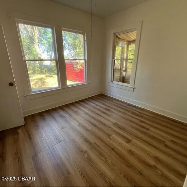 empty room featuring dark hardwood / wood-style floors