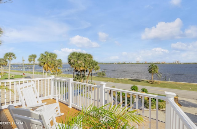 wooden deck featuring a water view