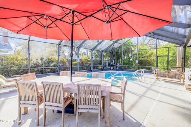 view of swimming pool with a patio area, a lanai, and a pool with connected hot tub