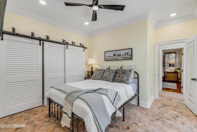 bedroom with baseboards, crown molding, and recessed lighting