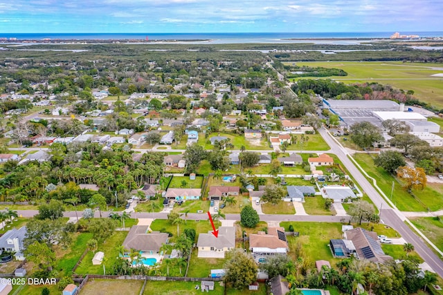 bird's eye view with a water view and a residential view