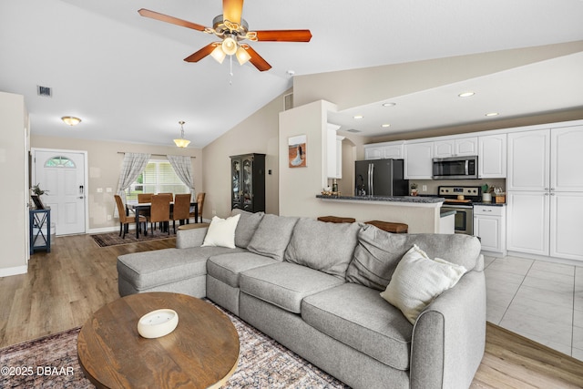 living room with lofted ceiling, ceiling fan, recessed lighting, visible vents, and light wood-style floors