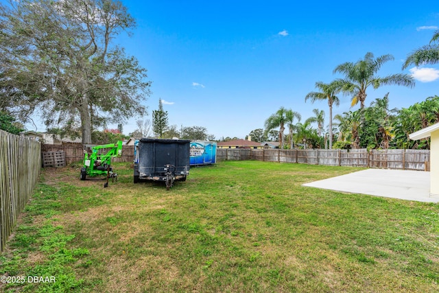 view of yard featuring a patio area and a fenced backyard