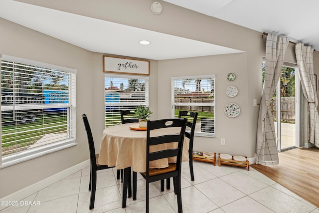 dining space with tile patterned flooring, baseboards, and recessed lighting