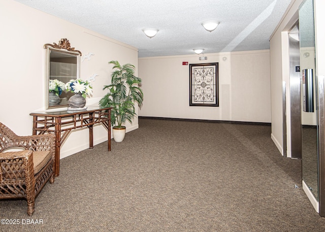 corridor featuring a textured ceiling and dark colored carpet