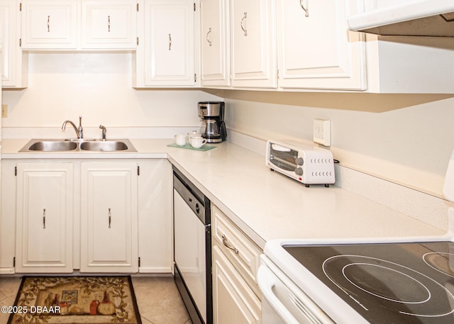 kitchen with stainless steel dishwasher, white cabinets, and range hood