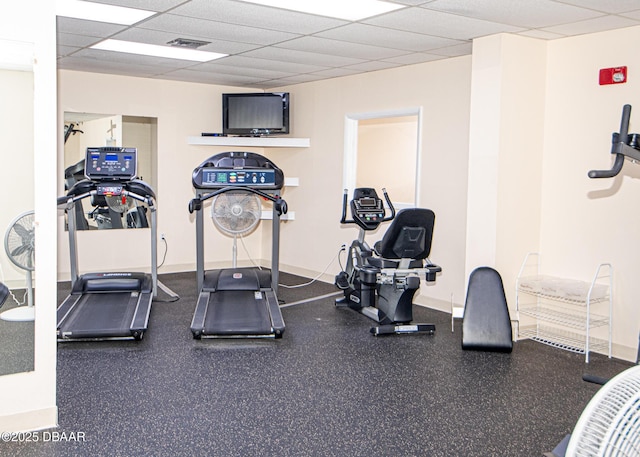 exercise room with a drop ceiling