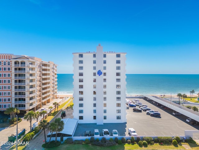 bird's eye view with a water view and a view of the beach