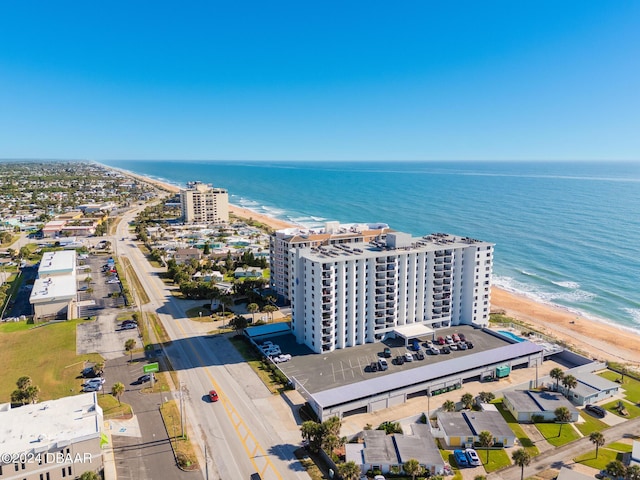 birds eye view of property featuring a view of the beach and a water view