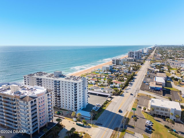 bird's eye view featuring a view of the beach and a water view