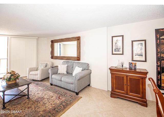 living room with light tile patterned floors and a textured ceiling