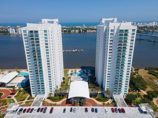 birds eye view of property with a water view