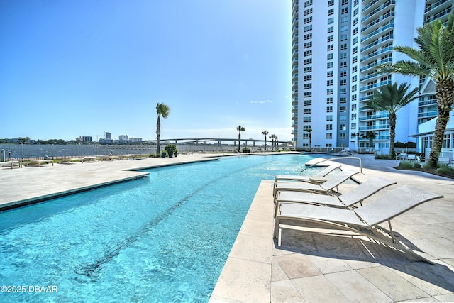 view of pool featuring a patio