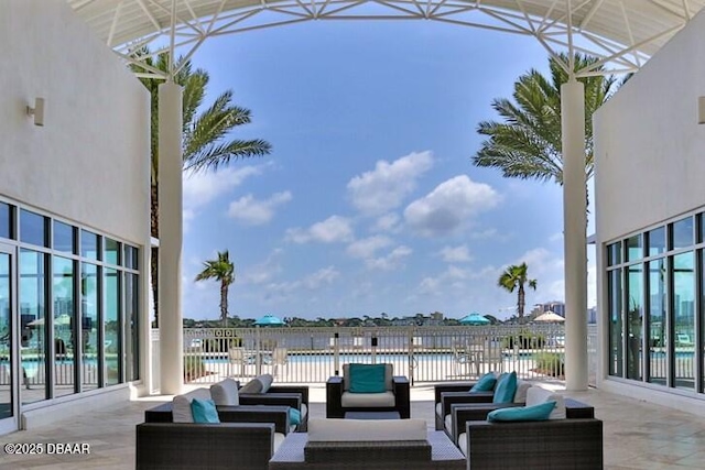 view of patio featuring a water view and an outdoor hangout area